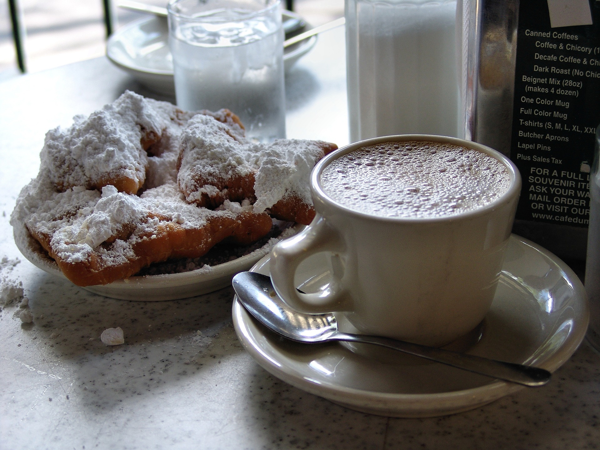 Picture of food and drink in New Orleans with coffee and Beignets