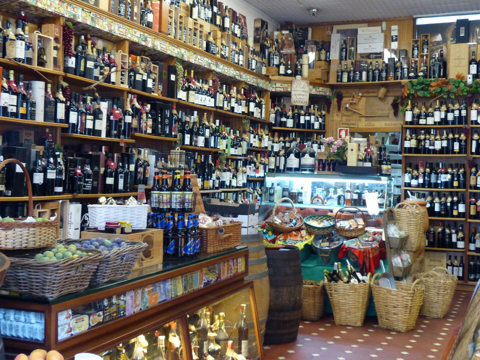 A shop filled with port wine, meats and cheeses
